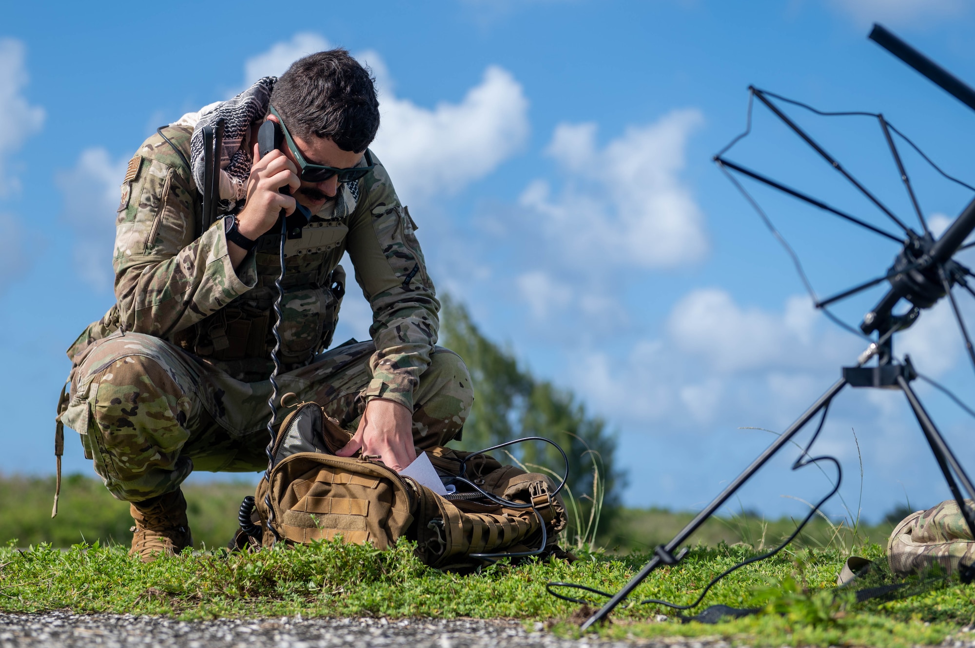 U.S. Air Force Staff Sgt. Justin Goeppinger, 644th Combat Communication Squadron expeditionary communications specialist, uses a communications system to contact members from the 644th CBCS on Andersen Air Force Base, Guam, at Tinian, Nov. 14, 2023.