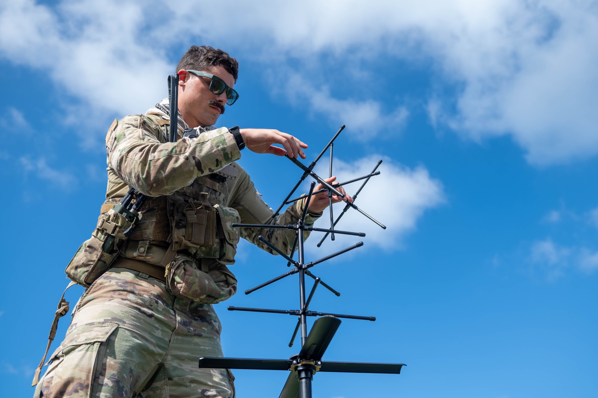 U.S. Air Force Staff Sgt. Justin Goeppinger, 644th Combat Communication Squadron expeditionary communications specialist, sets up an antenna at Tinian, Nov. 14, 2023.