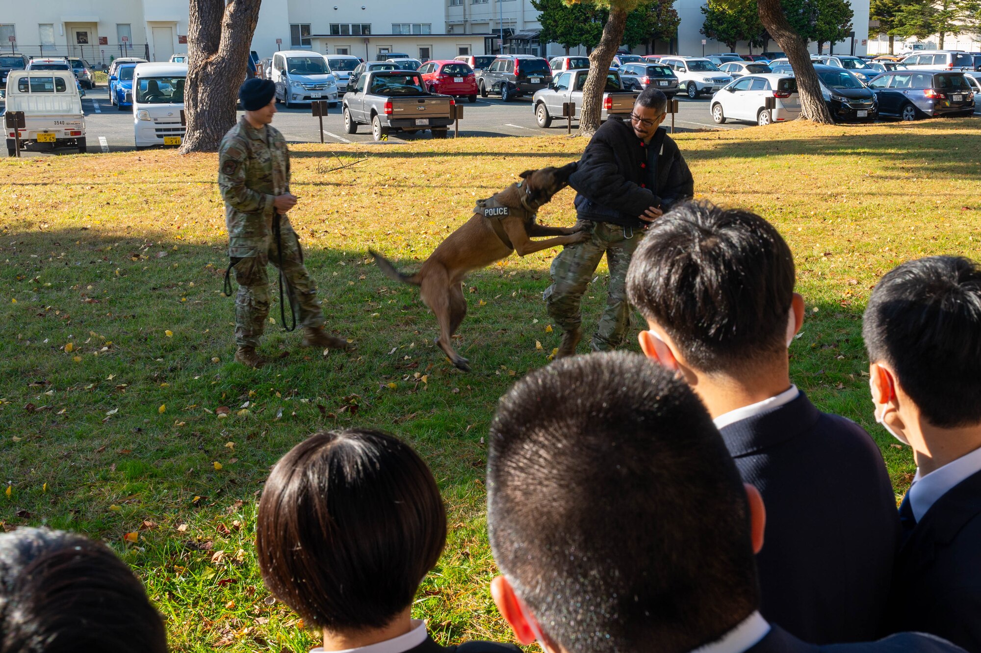 Aomori Prefecture Police cadets attend a Military Working Dog (MWD) demonstration at Misawa Air Base, Japan.
