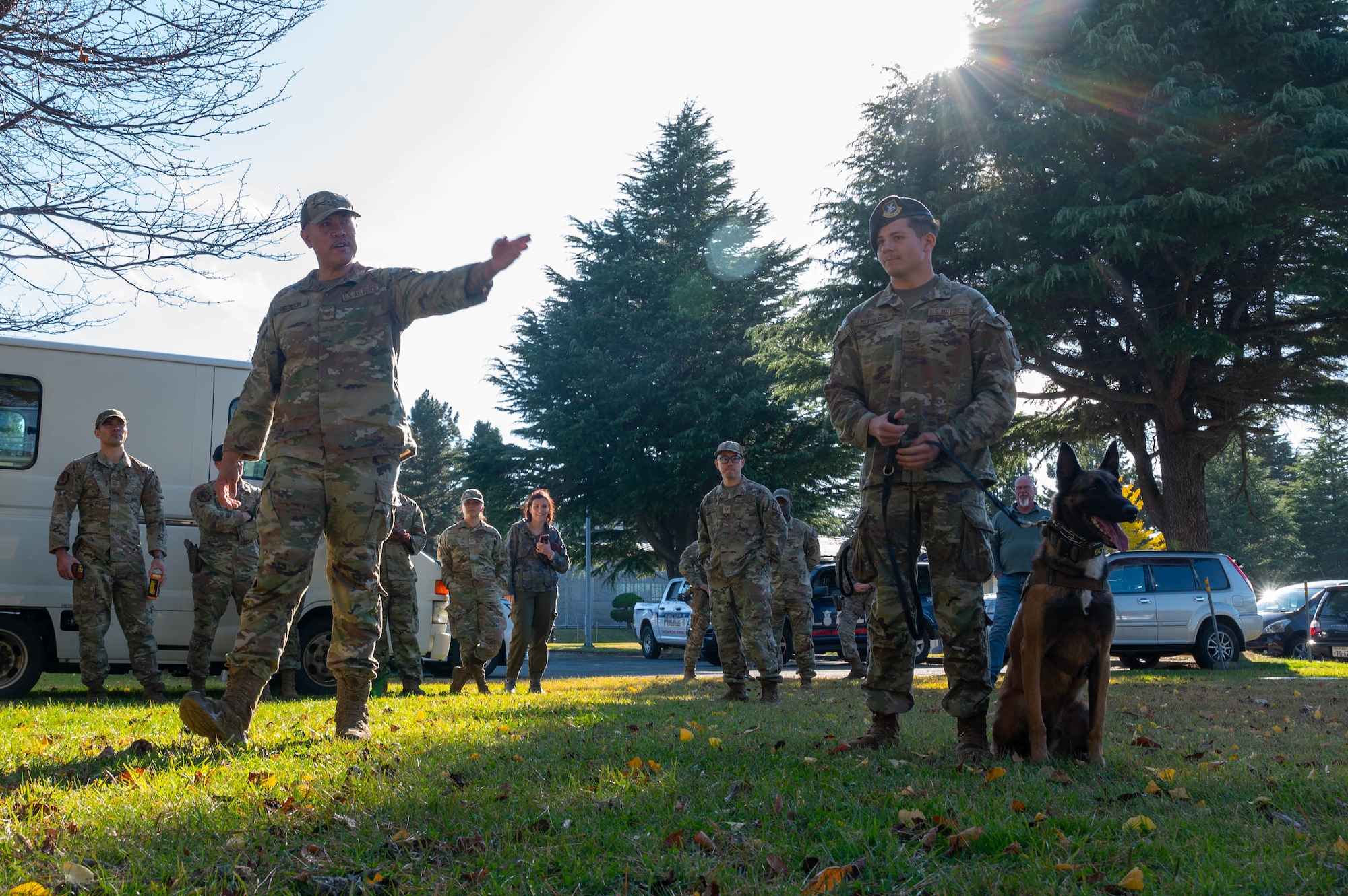 U.S. Air Force Staff Sgt. Micheal Dacoron and Airman 1st Class Samuel Mcpheron, 35th Security Forces Squadron military working dog (MWD) handlers, perform a MWD Demonstration for Aomori Prefecture Police cadets at Misawa Air Base, Japan.