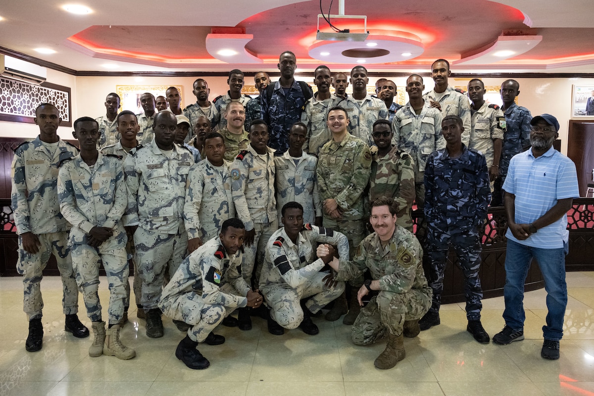 Group photo of U.S. and Djiboutian Coast Guard members service members.