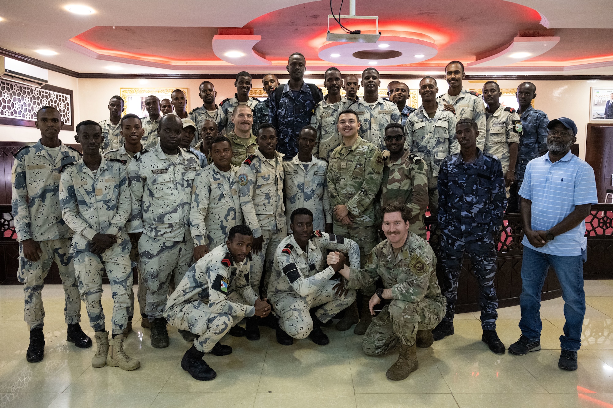 Group photo of U.S. and Djiboutian Coast Guard members service members.