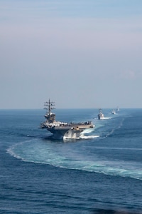 The Dwight D. Eisenhower Carrier Strike Group (IKECSG) transits the Strait of Hormuz, Nov. 26. The IKECSG is deployed to the U.S. 5th Fleet area of operations to support maritime stability and security in the Middle East region.  (U.S. Navy photo by Mass Communication Specialist 2nd Class Merissa Daley)