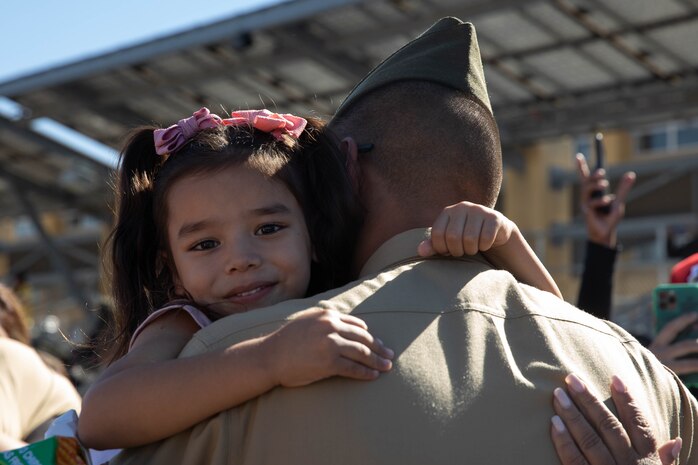 A new U.S. Marine with Golf Company, 2nd Recruit Training Battalion, is greeted by a guest after a family day ceremony at Marine Corps Recruit Depot San Diego, Nov. 20, 2023. After a long, 13 weeks of physical and mental challenges, early mornings, letters to and from home, this is the first time friends and families will see their newly transformed Marines. (U.S. Marine Corps photo by Lance Cpl. Sarah M. Grawcock)