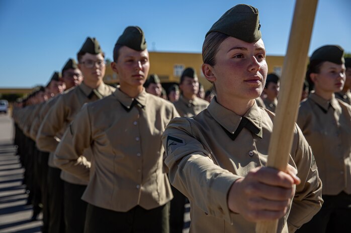 New U.S. Marines with Golf Company, 2nd Recruit Training Battalion, stand in formation before their family day ceremony at Marine Corps Recruit Depot San Diego, Nov. 20, 2023. After a long, 13 weeks of physical and mental challenges, early mornings, letters to and from home, this is the first time friends and families will see their newly transformed Marines. (U.S. Marine Corps photo by Lance Cpl. Sarah M. Grawcock)