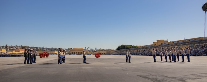 New U.S. Marines and drill instructors with Golf Company, 2nd Recruit Training Battalion, present the guidons for their platoons during a graduation ceremony at Marine Corps Recruit Depot San Diego, Nov. 21, 2023. Graduation took place at the completion of the 13- week transformation, which included training for drill, marksmanship, basic combat skills, and Marine Corps customs and traditions. (U.S. Marine Corps photo by Lance Cpl. Janell B. Alvarez)