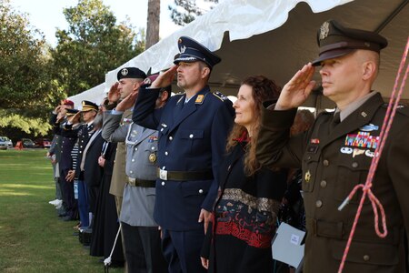 CCoE Leaders render a salute for the National Anthems of Germany, Italy and the United States during the German-Italian POW/MIA Memorial Ceremony Nov. 17, 2023.