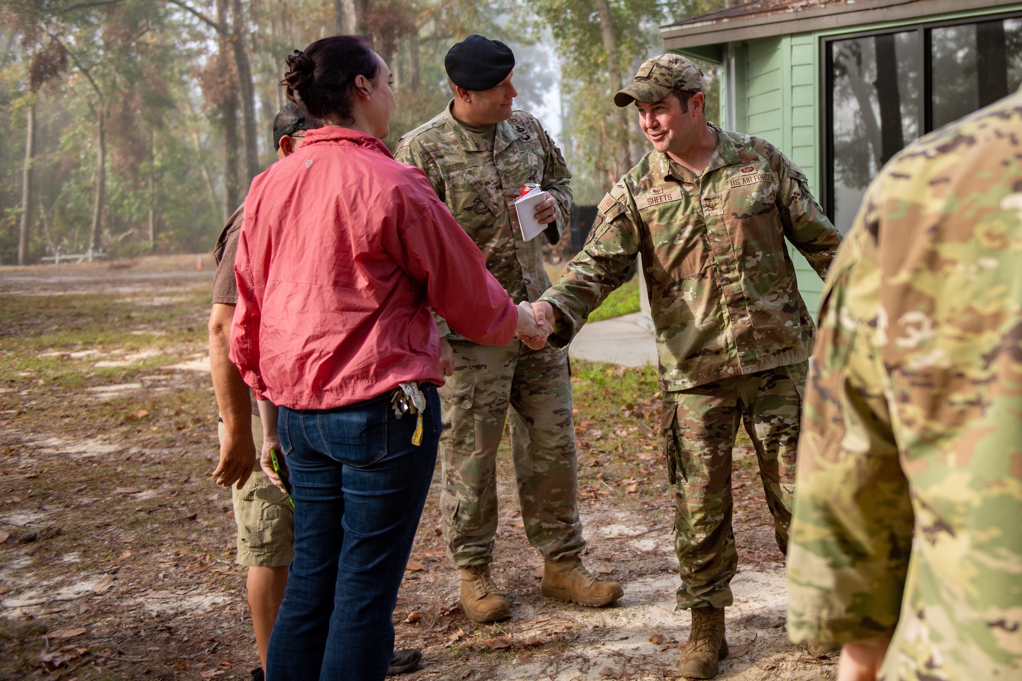 U.S. Air Force Col. Paul Sheets, 23rd Wing commander, shakes hands with a recreation management team member after a tour of Grassy Pond in Lake Park, Georgia, Oct. 30, 2023. While on tour of the grounds, the commander expressed his goal to restore the recreational facility back to its operational capacity for 70,000 people who use the site each year. (U.S. Air Force photo by Senior Airman Courtney Sebastianelli)