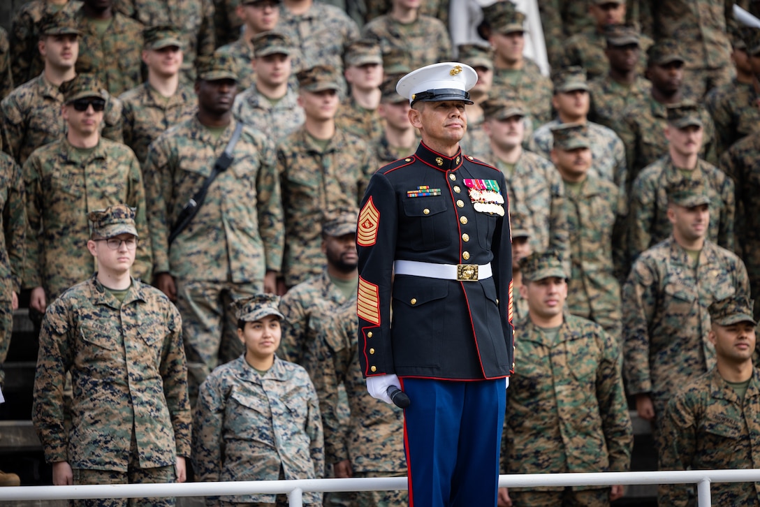 U.S. Marine Corps Sgt. Maj. Carlos A. Ruiz, sergeant major of the Marine Corps, right, a native of Sonora, Mexico, stands at attention for the Marines’ Hymn during the cake cutting ceremony in honor of the 248th Marine Corps birthday at Butler Stadium on Marine Corps Base Quantico, Virginia, Nov. 7, 2023. The annual cake cutting ceremony is a long-standing tradition which celebrates the establishment of the United States Marine Corps. The Marine Corps birthday is celebrated every year to commemorate the birth of the Corps and honor the service and sacrifices of all Marines, past and present. (U.S. Marine Corps photo by Lance Cpl. Joaquin Dela Torre)
