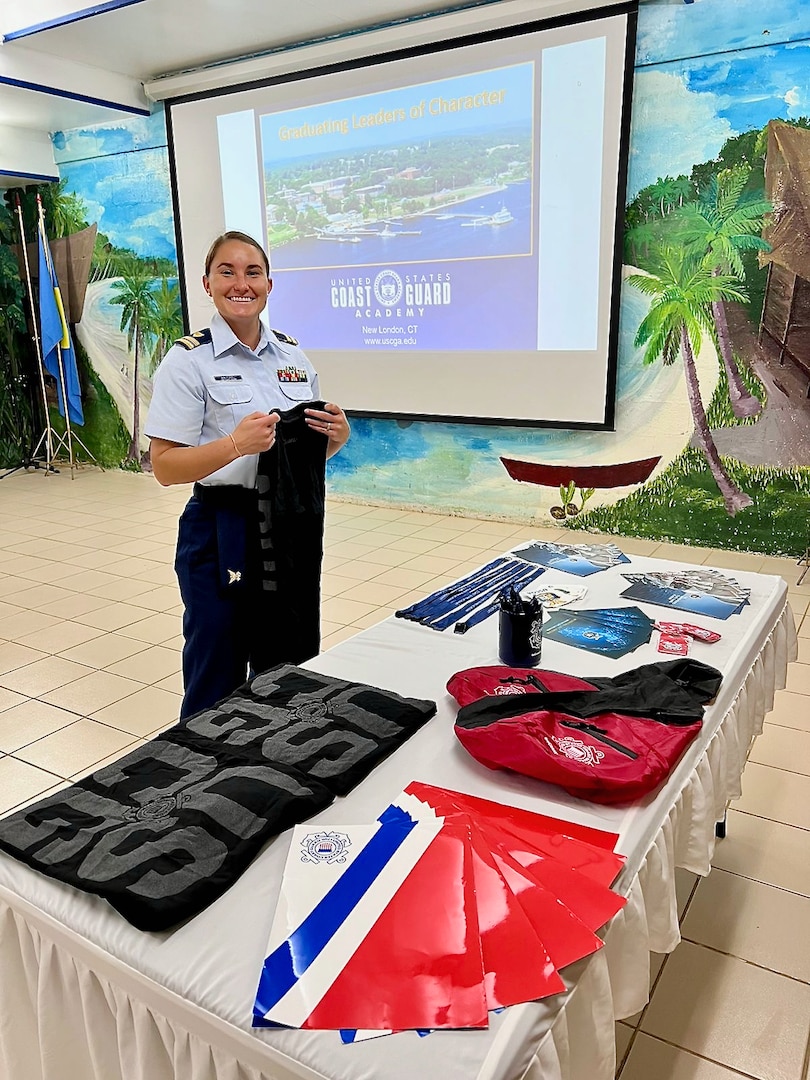 Lt. Anna Vaccaro sets up a table for a U.S. Coast Guard Academy recruiting event at the Palau Community College in Koror, Palau, in November 2023. In an enduring commitment to regional stability and cooperative security, U.S. Coast Guard Forces Micronesia/Sector Guam personnel visited Palau and participated in a bilateral Joint Committee Meeting (JCM) with the Republic of Palau, alongside U.S. Indo-Pacific Command (INDOPACOM) and the U.S. Department of State representatives in Palau from Nov. 14-17, 2023. (U.S. Coast Guard photo)