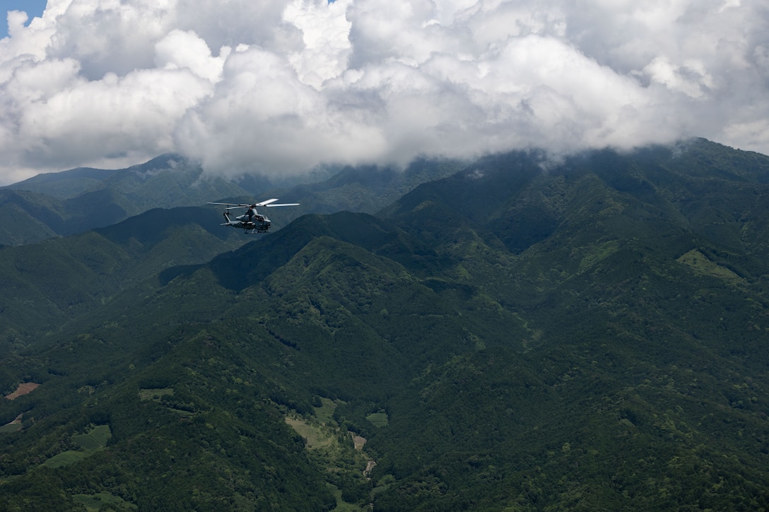 A U.S. Marine Corps AH-1Z Viper with Marine Light Attack Helicopter Squadron (HMLA) 169, Marine Aircraft Group 36, conducts flight operations during Shinka 23 over Combined Arms Training Center (CATC), Camp Fuji, Japan, June 13, 2023. 1st Marine Aircraft Wing is supporting 3rd Marine Division’s execution of Shinka 23 by providing combat assault transport and aerial escort, aerial delivery operations, and simulated close air support. Shinka 23 is a company-level force-on-force exercise, split into two week-long realistic training scenarios. (U.S. Marine Corps photo by Lance Cpl. Emily Weiss)