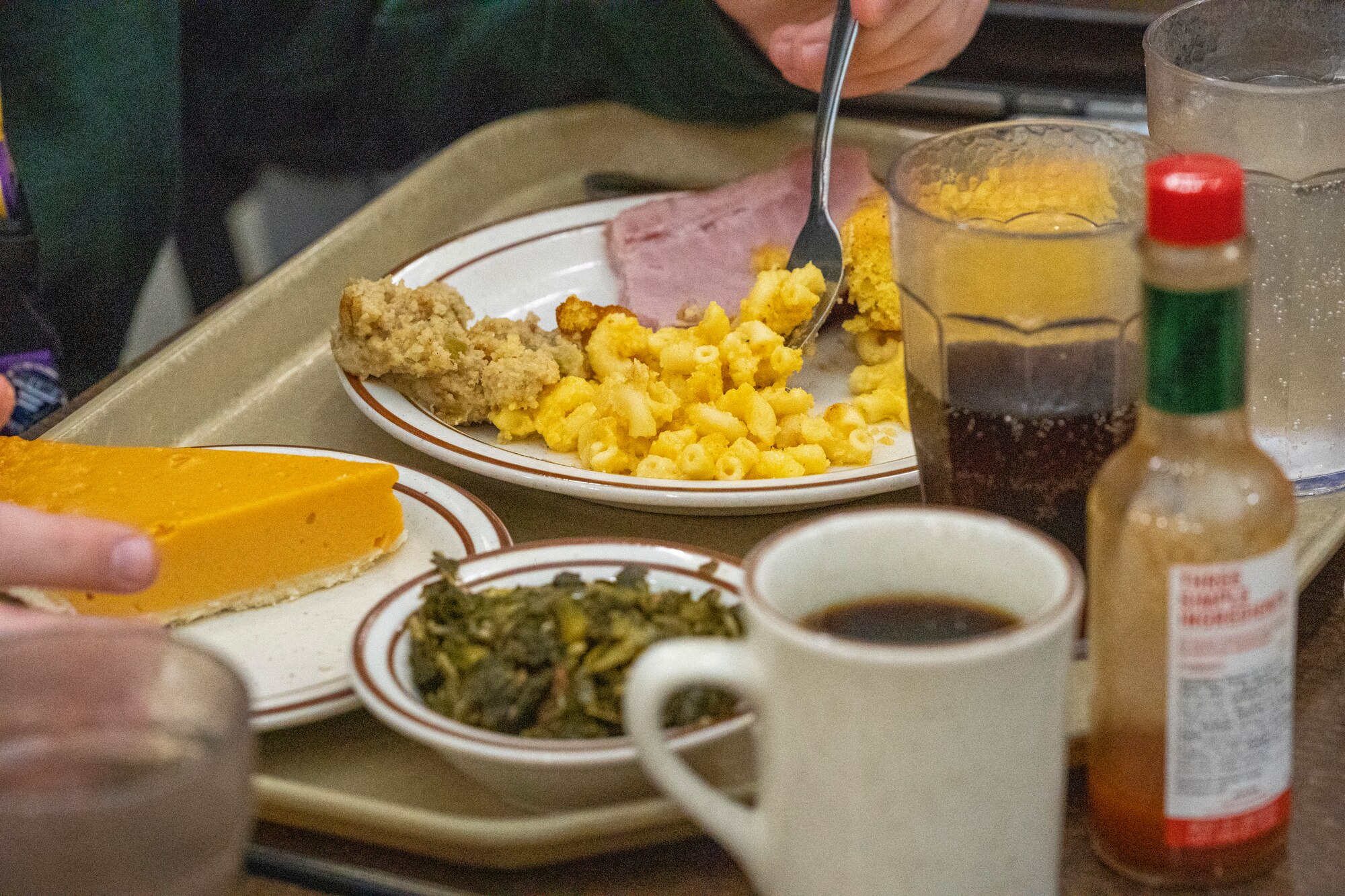An Airman from the 81st Training Wing eats a Thanksgiving meal at Keesler Air Force Base, Mississippi, Nov. 23, 2023.