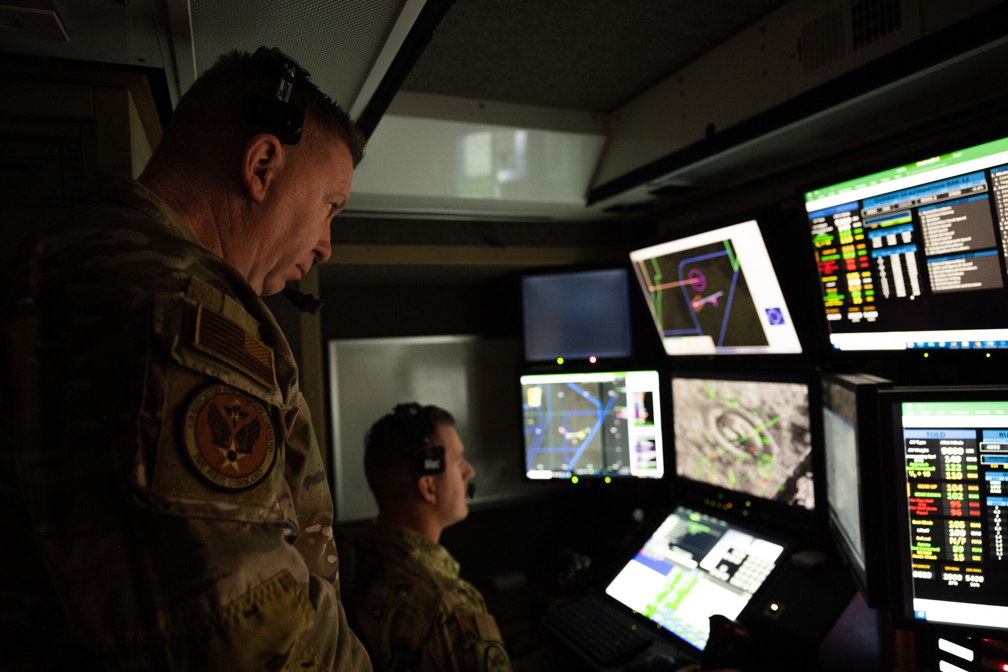 U.S. Air Force Chief Master Sgt. Chad Bickley, command chief of Air Education and Training Command, observes an MQ-9 Reaper training sortie in a ground control station at Holloman Air Force Base, New Mexico, Nov. 8, 2023. Bickley, who assumed the AETC command chief position in June, spoke with and learned from Airmen across the 49th Wing as they conducted their mission of Building Combat Aircrew. (U.S. Air Force photo by Senior Airman Antonio Salfran)
