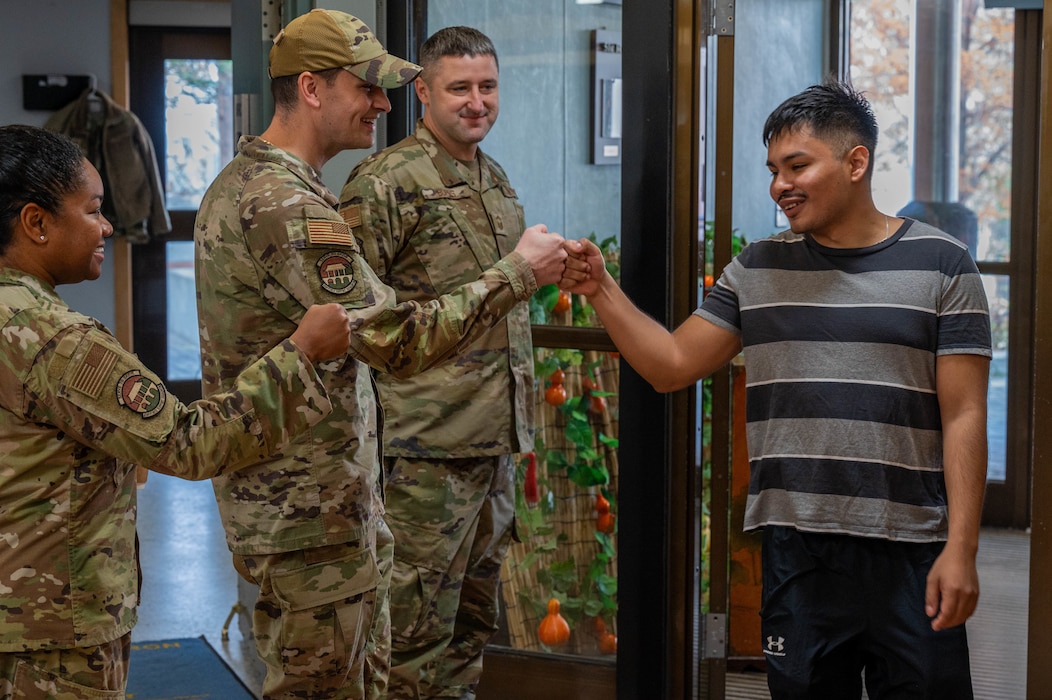 Leadership from the 51st Force Support Squadron greet Airmen as they enter the Ginkgo Tree Dining Facility on Thanksgiving at Osan Air Base, Republic of Korea, Nov. 23, 2023. Base leadership used the holiday as an opportunity to take care of the Airmen that reside on base by spending time with them and serving them food, reinforcing that Airmen and their families are vital to the operations of the base. (U.S. Air Force photo by Airman 1st Class Chase Verzaal)