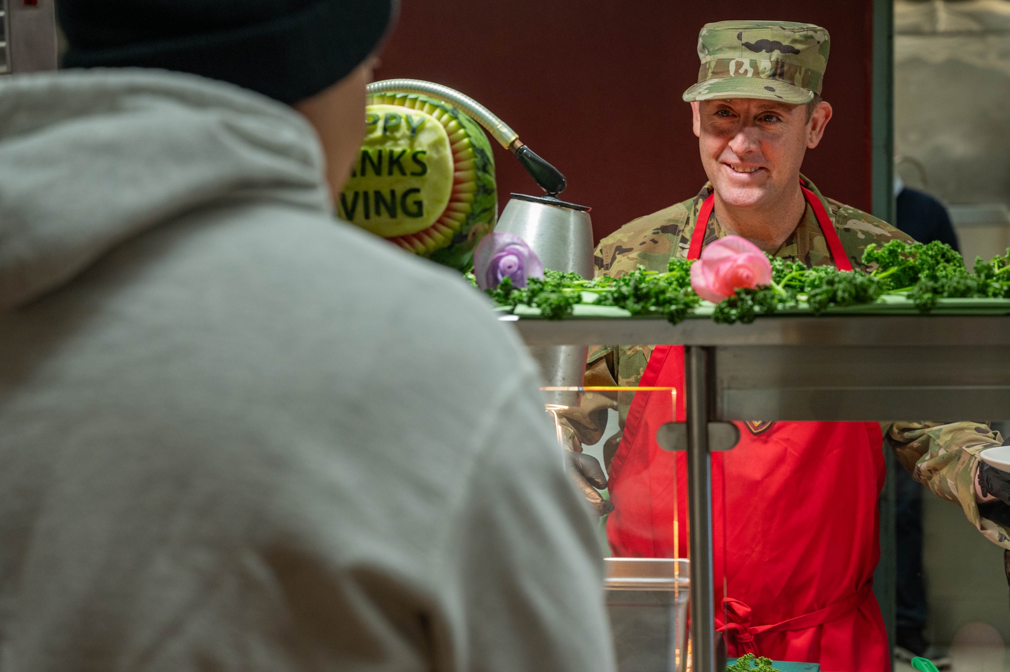 Osan leadership plating food for airmen.