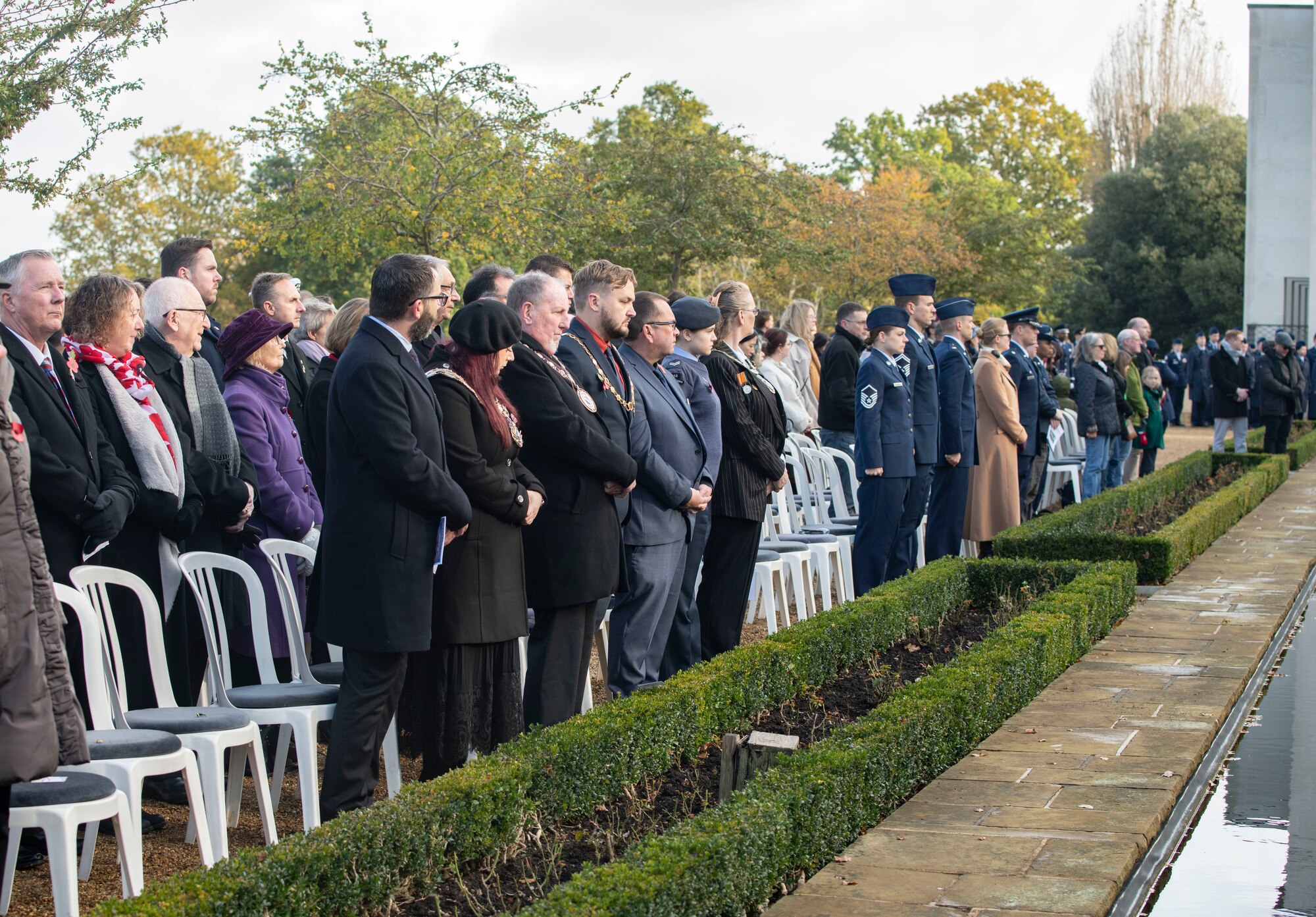 Attendees of the 501st Combat Support Wing’s Veterans Day ceremony listen to Taps being played at the Cambridge American Cemetery and Memorial, England