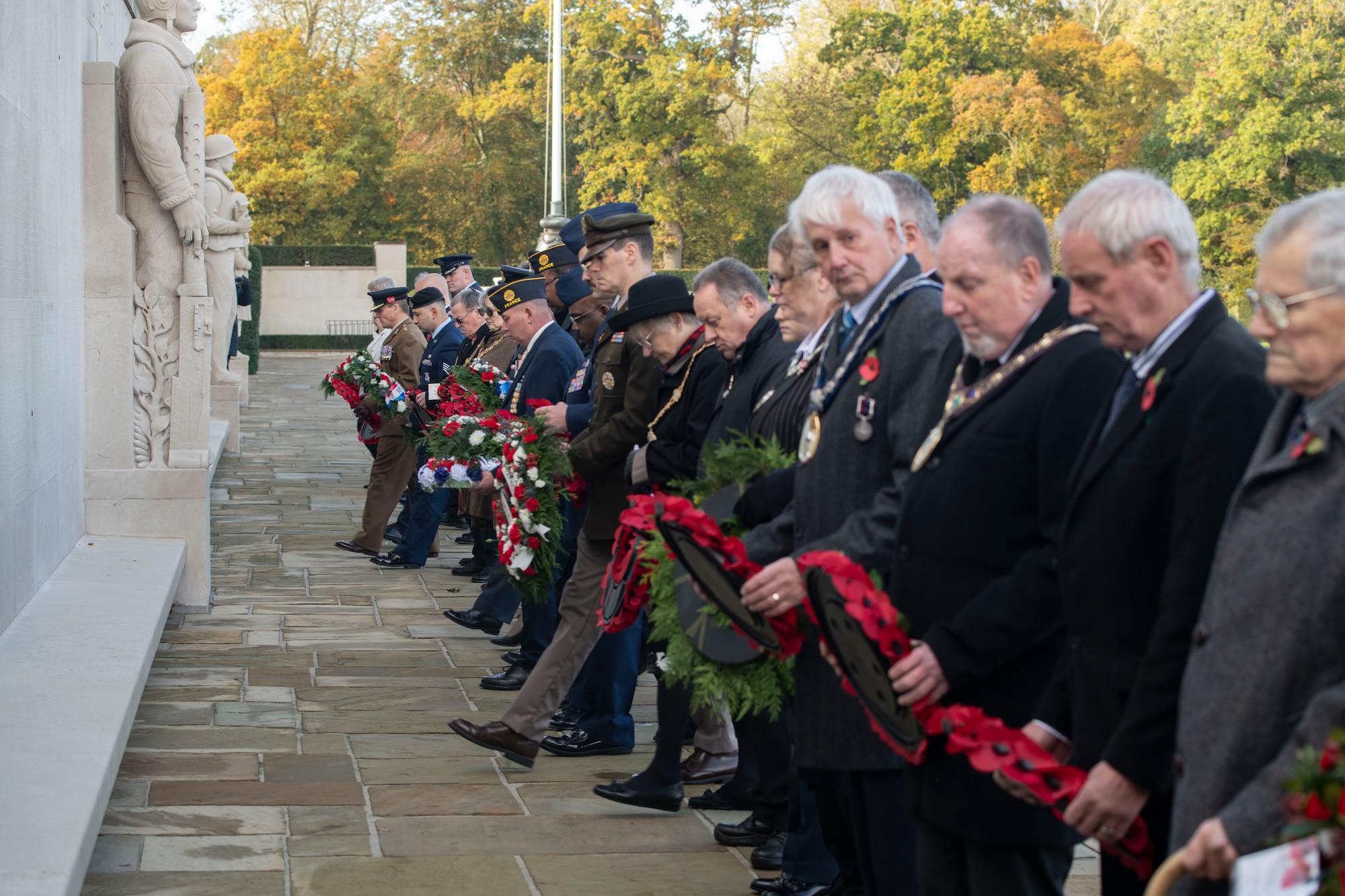 Attendees of the 501st Combat Support Wing’s Veterans Day ceremony lay wreaths at the Cambridge American Cemetery and Memorial, England