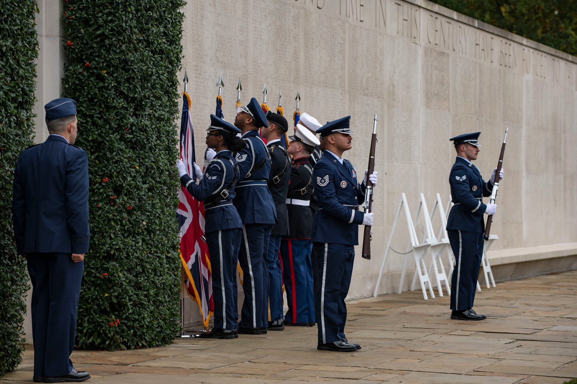 Members of the 501st Combat Support Wing honor guard post the colors at the Cambridge American Cemetery and Memorial, England