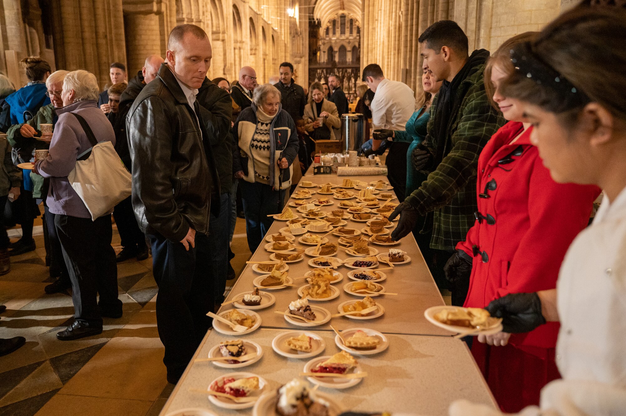 Attendees of the annual Thanksgiving Eve service at Ely Cathedral in Ely, England, participate in a pie social event following the event, Nov. 22, 2023.