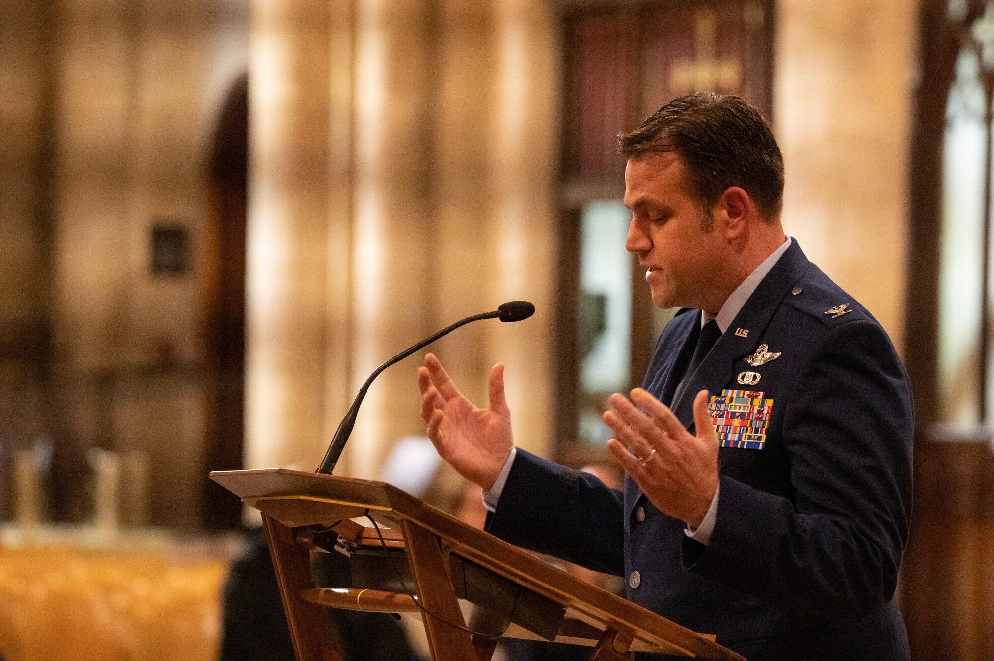 U.S. Air Force Col. Joseph Wall, 100th Air Refueling Wing deputy commander, speaks to attendees during the annual Thanksgiving Eve service at Ely Cathedral, Ely, England, Nov. 22, 2023.