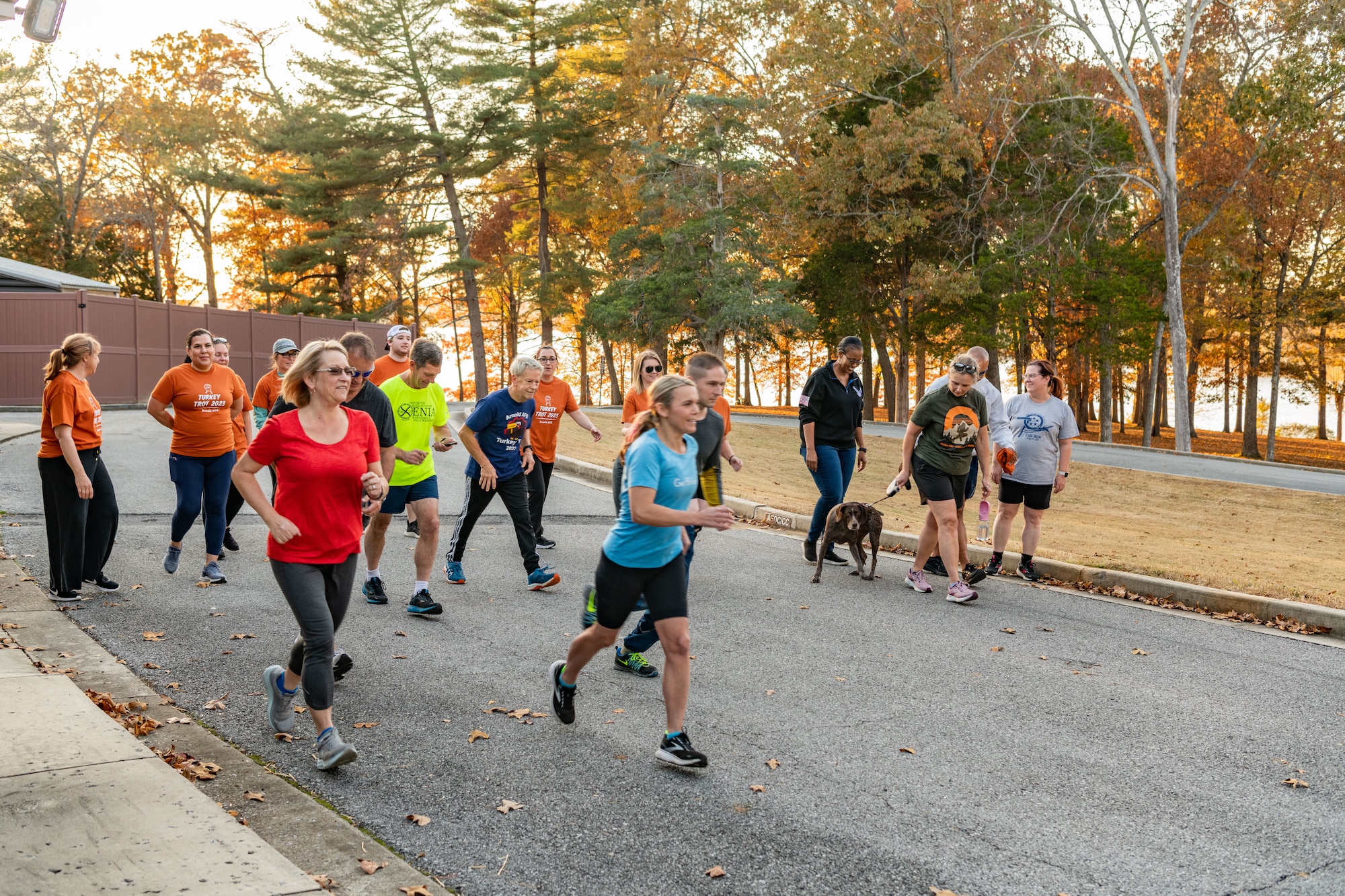 Participants cross the starting line to begin the 38th annual Arnold Engineering Development Complex Turkey Trot, Nov. 7, 2023, at the Arnold Lakeside Complex at Arnold Air Force Base, Tenn. The event included members of the AEDC workforce. (U.S. Air Force photo by Keith Thornburgh)