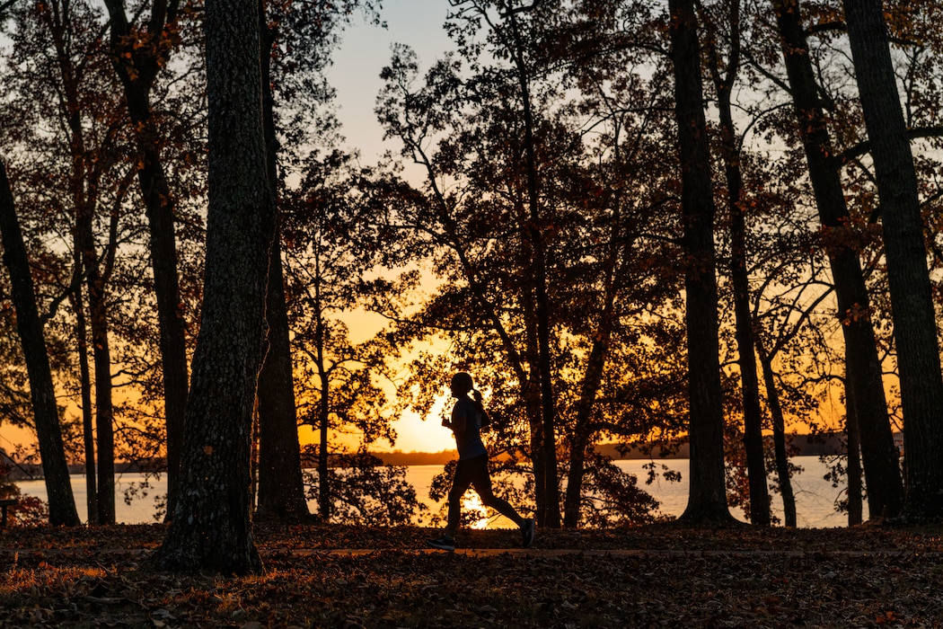 An Arnold Air Force Base resident runs along a trail at the Arnold Lakeside Complex at Arnold Air Force Base. Base personnel and their families will have the opportunity to take in the fall foliage during the 39th annual Turkey Trot Fun Run that is set to take place at 9 a.m. Saturday, Nov. 23 at the ALC at Arnold AFB, Tenn. (U.S. Air Force photo by Keith Thornburgh)