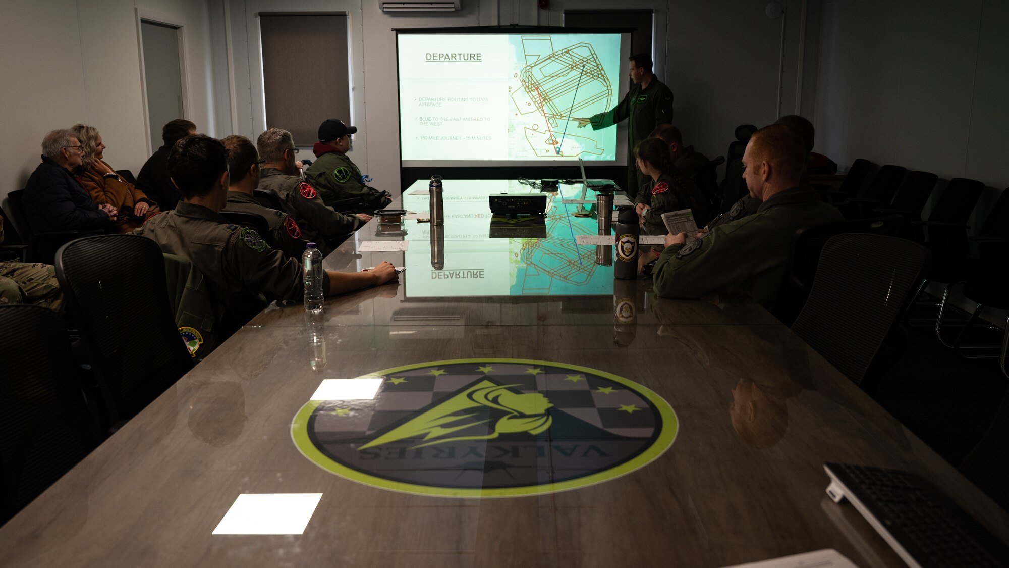 Pilot for a Day, Ethan Ridd listens intently to U.S. Air Force Maj. David "Evil" Bown give a preflight brief.