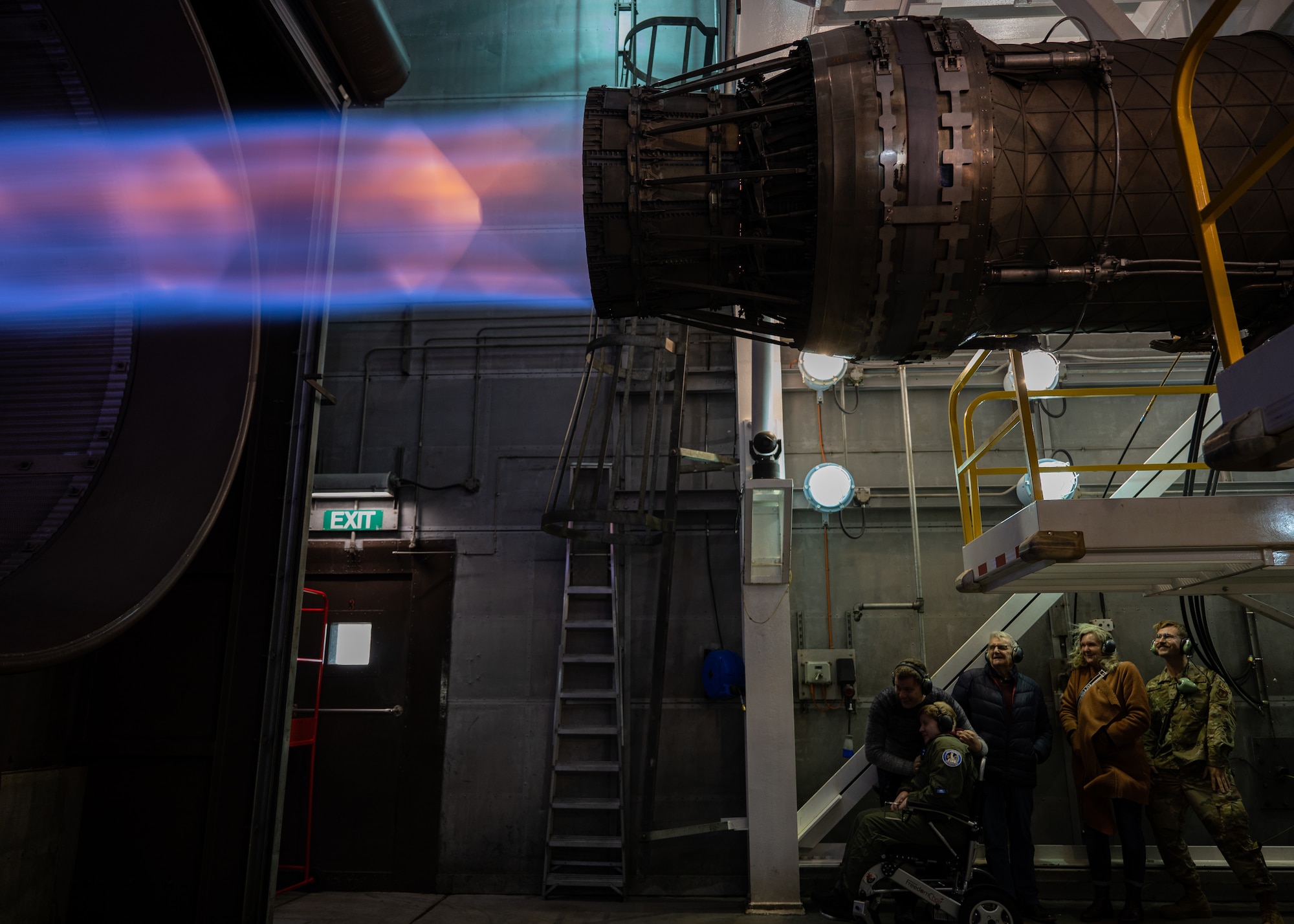 Pilot for A Day, Ethan Ridd and family wtach on as an afterburner is powered on in the test cell.