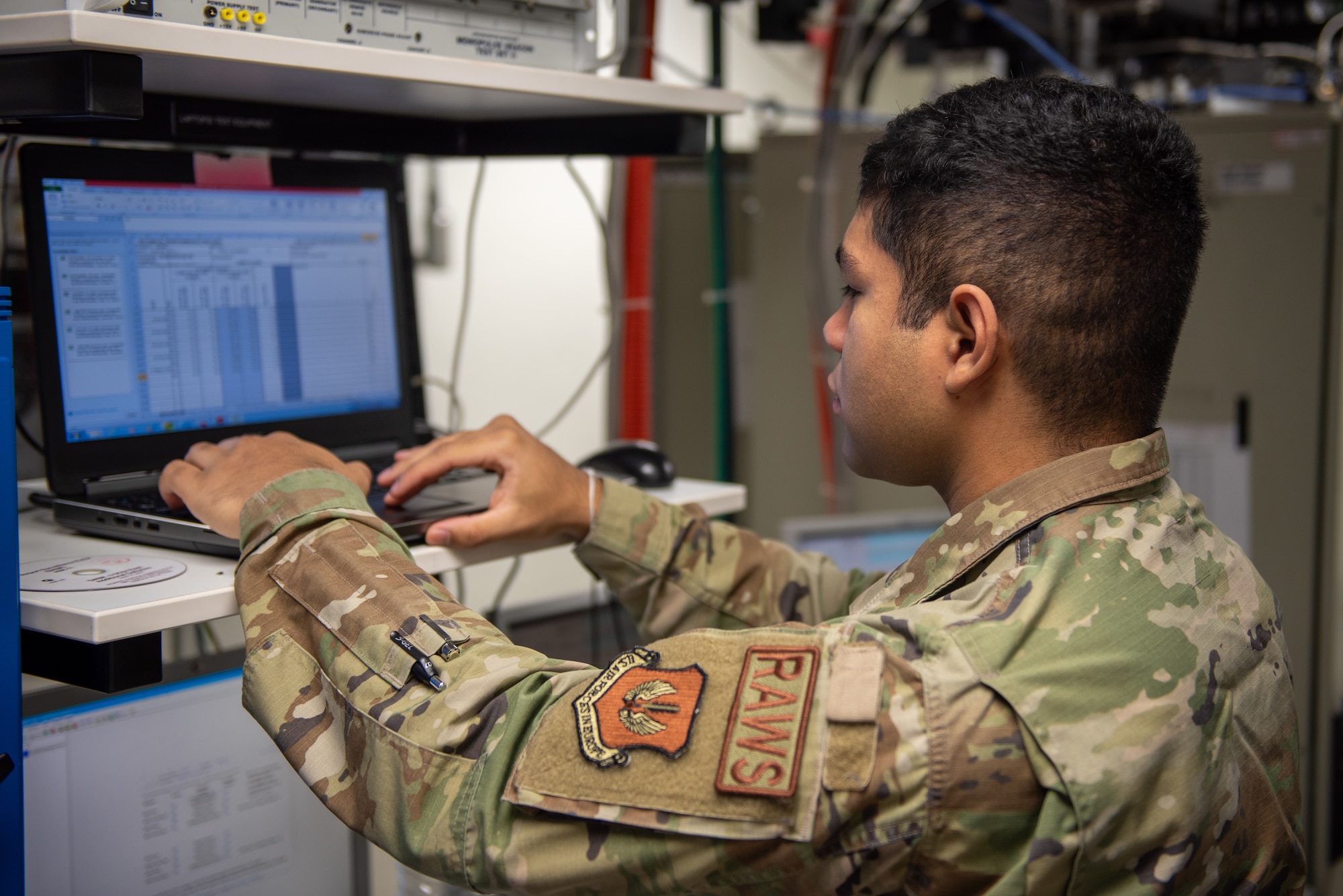 A U.S. Air Force Airman assigned to the 52nd Operation Support Squadron (OSS), Radar Airfield and Weather Systems (RAWS) conducts a maintenance check on a Ceilometer site at Spangdahlem, Germany, Nov. 14, 2023. 52 OSS RAWS Airmen play a vital role in keeping important airfield control and information systems up and running. (U.S. Air Force photo by Airman 1st Class Albert Morel)