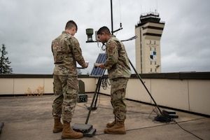 A U.S. Air Force Airman assigned to the 52nd Operation Support Squadron (OSS), Radar Airfield and Weather Systems (RAWS) conducts a maintenance check on a Ceilometer site at Spangdahlem, Germany, Nov. 14, 2023. 52 OSS RAWS Airmen play a vital role in keeping important airfield control and information systems up and running. (U.S. Air Force photo by Airman 1st Class Albert Morel)