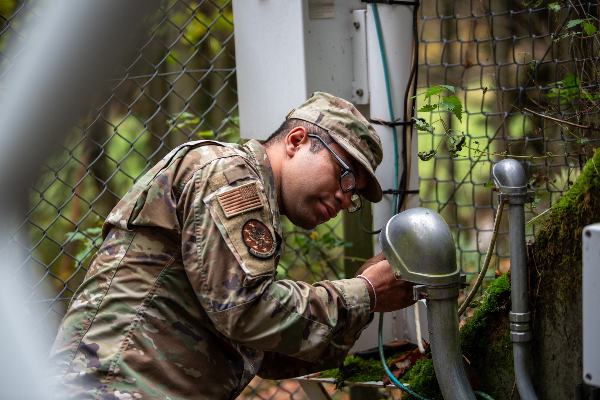 A U.S. Air Force Airman assigned to the 52nd Operation Support Squadron (OSS), Radar Airfield and Weather Systems (RAWS) conducts a maintenance check on a Ceilometer site at Spangdahlem, Germany, Nov. 14, 2023. 52 OSS RAWS Airmen play a vital role in keeping important airfield control and information systems up and running. (U.S. Air Force photo by Airman 1st Class Albert Morel)