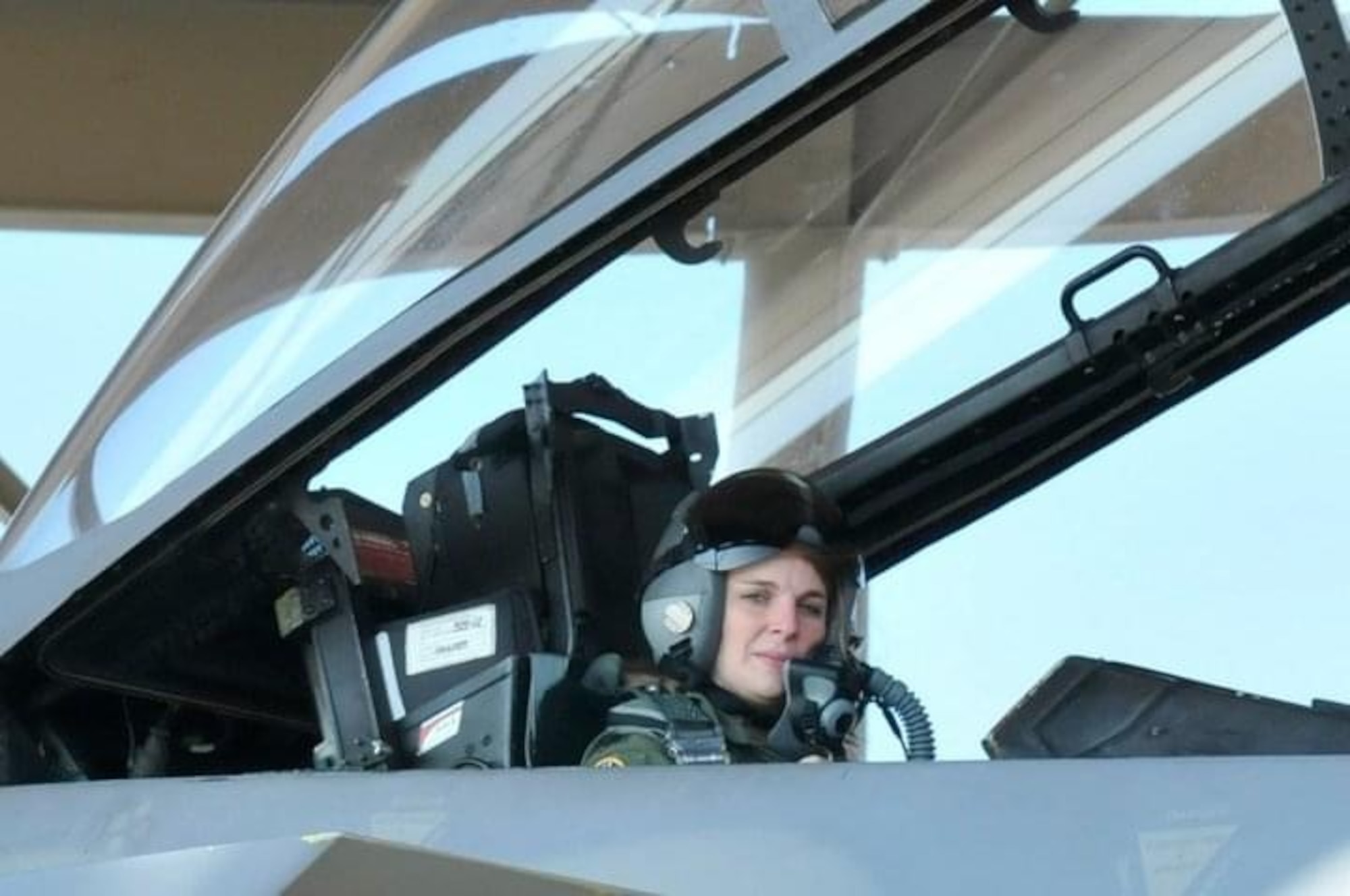 Maj. (Dr.) Jennifer Waterman, sits in an F-15 prior to being hired as the 303rd Fighter Squadron flight doctor. Like many traditional reservists, Waterman has two careers. In her civilian role, she is an orthopedic surgeon newly relocated from Kansas to Maine.