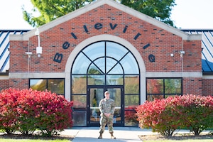Airman Stands outside of Military Dormitories