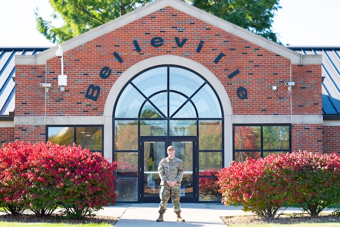 Airman Stands outside of Military Dormitories