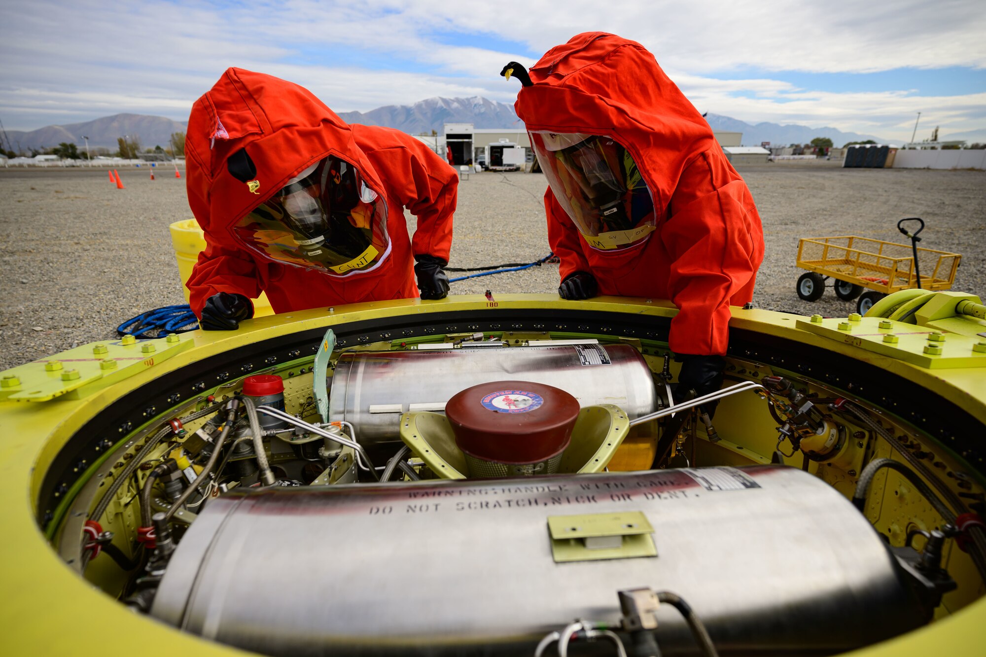 Members of the Missile Mishap Recovery Team work to recover a missile guidance system during an exercise simulating a transportation accident involving a missile component containing hazardous material at the Box Elder County Fairgrounds, Tremonton, Utah, Nov. 2, 2023. The MMRT is on call 24/7, 365 days a year to respond to any number of situations involving an intercontinental ballistic missile where technical procedures do not exist to address the mishap or the loss of life is possible. (U.S. Air Force photo by R. Nial Bradshaw)