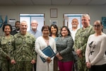 Staff aboard Naval Health Clinic Cherry Point bid Fair Winds and Following Seas to Ms. Ruth Urcinole, BSN, RN, CCM on Wednesday, November 29, 2023.

Urcinole, center, with folder, served aboard the clinic as a Nurse Consultant in the Healthcare Business department and was presented her five-year-service pin by Capt. Sean Barbabella, commander of Naval Health Clinic Cherry Point, during a ceremony November 28.