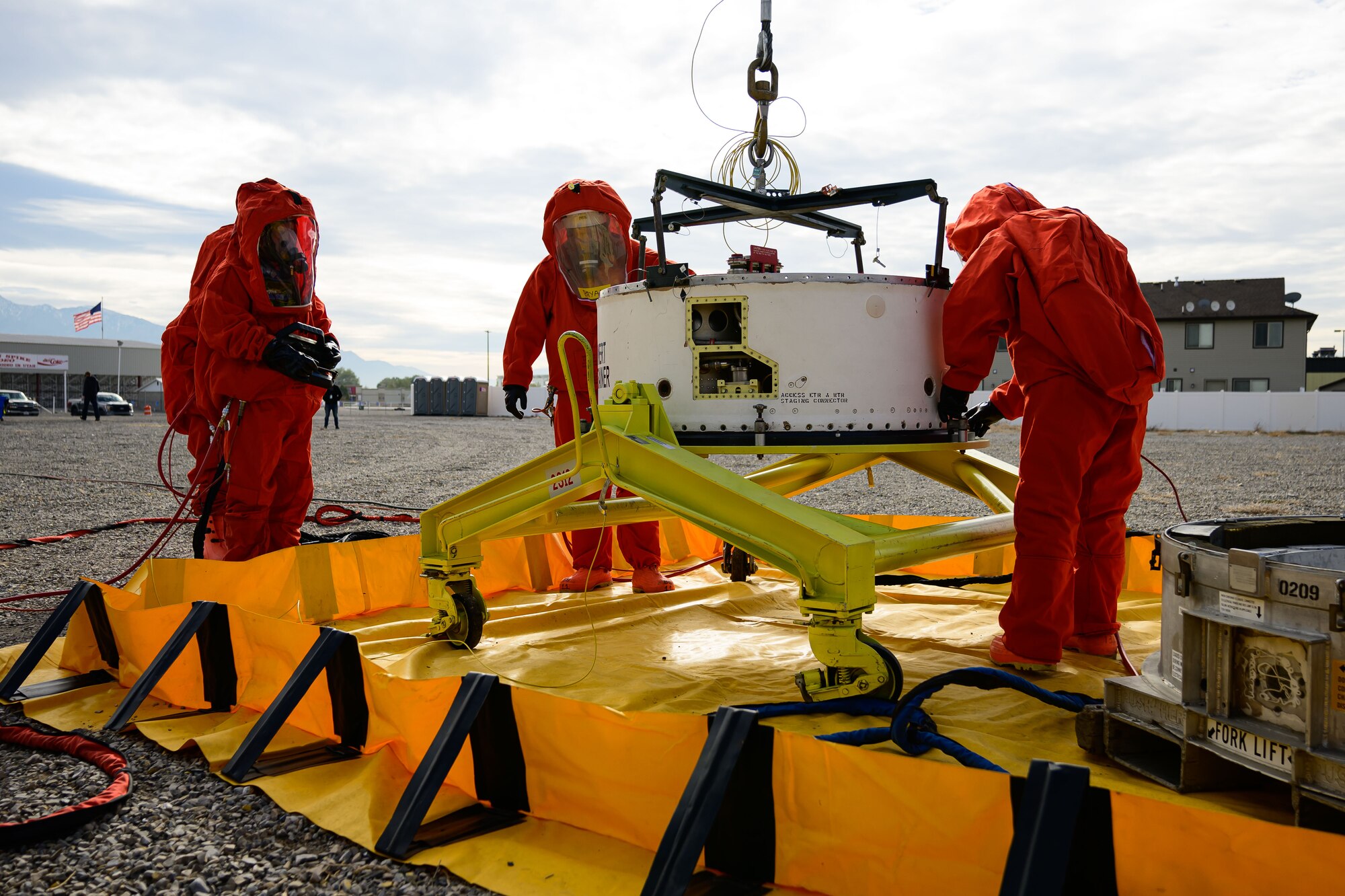 Members of the Missile Mishap Recovery Team work to recover a missile guidance system during an exercise simulating a transportation accident involving a missile component containing hazardous material at the Box Elder County Fairgrounds, Tremonton, Utah, Nov. 2, 2023. The MMRT is on call 24/7, 365 days a year to respond to any number of situations involving an intercontinental ballistic missile where technical procedures do not exist to address the mishap or the loss of life is possible. (U.S. Air Force photo by R. Nial Bradshaw)