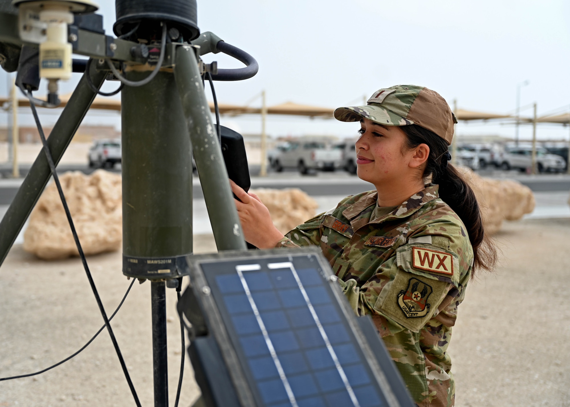 2nd Lt. Shahana Gray, expeditionary operations support squadron weather flight commander, checks weather equipment at an undisclosed location.