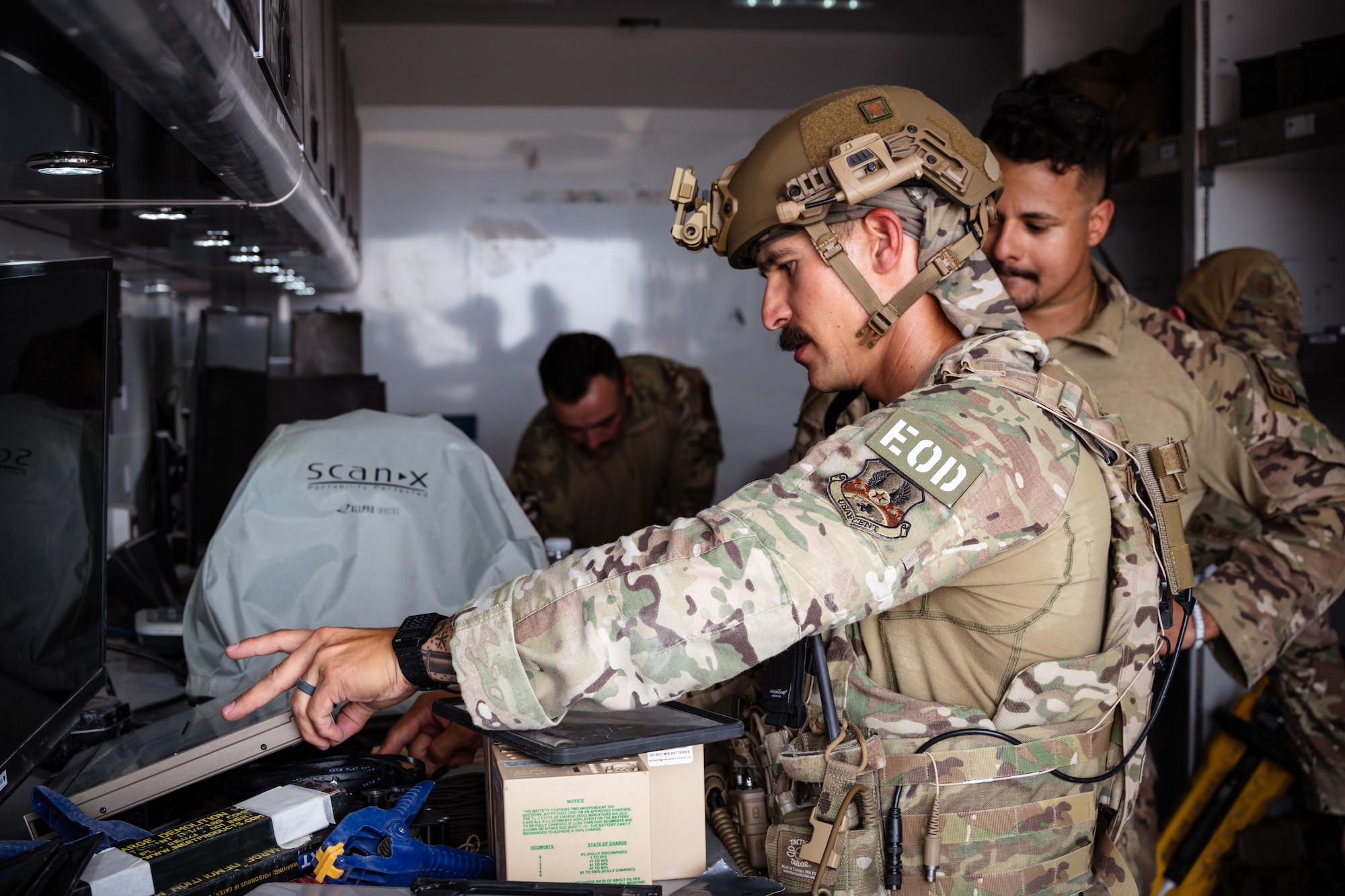 Explosive ordnance disposal Airmen review imagery collected from a suspicious package exercise at an undisclosed location in the U.S. Central Command area of responsibility.