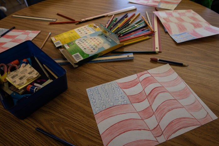 Students from Angier Elementary School, celebrate Veteran's Day with drawings of the American Flag at Angier Elementary in San Diego, California, Nov. 9, 2023. With 67% of the Angier Elementary student population being directly tied to military service members, the school was recognized as a Purple Star School two years in a row because of its commitment to supporting the unique educational and social-emotional needs of military-connected children. Rummler is a native of Oscar, Louisiana. (U.S. Marine Corps photo by Lance Cpl. Sarah M. Grawcock)