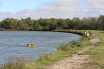 Roger Stillick, U.S. Army Corps of Engineers (USACE), Galveston District (SWG), Advanced Data Section drone operator, controls the Z-boat, a remote hydrographic survey vessel, on a section of the Trinity River, Nov. 15, 2023.