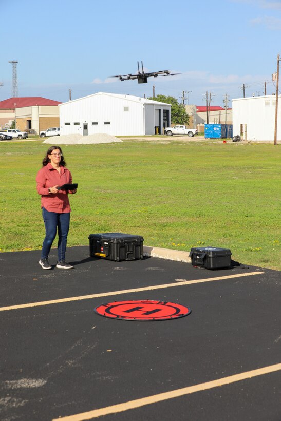Rebecca Capps, U.S. Army Corps of Engineers (USACE), Galveston District (SWG), physical scientist and drone operator, performs a system check on a Skydio X2D quadcopter, which has a 30-minute flight time and can hover, for use in photogrammetry and visual inspections.