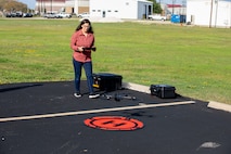 Rebecca Capps, U.S. Army Corps of Engineers (USACE), Galveston District (SWG), physical scientist and drone operator, performs a system check on a Skydio X2D quadcopter, which has a 30-minute flight time and can hover, for use in photogrammetry and visual inspections.