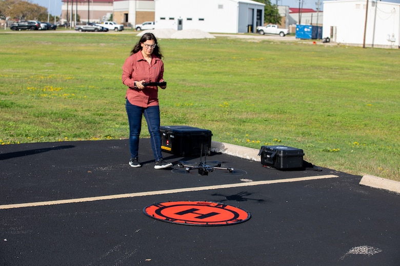 Rebecca Capps, U.S. Army Corps of Engineers (USACE), Galveston District (SWG), physical scientist and drone operator, performs a system check on a Skydio X2D quadcopter, which has a 30-minute flight time and can hover, for use in photogrammetry and visual inspections.