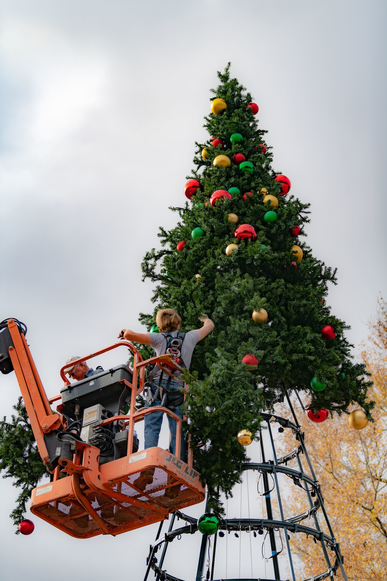 Arnold Air Force Base team members help assemble the large Christmas tree located just inside the Main Gate at Arnold AFB, Tenn, Nov. 9, 2023. A lighting ceremony for the 40-foot-tall, 22-foot-wide tree is scheduled for Dec. 4, 2023, at 4 p.m. (U.S. Air Force photo by Keith Thornburgh)