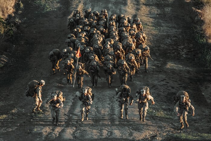 U.S. Marine Corps recruits with Charlie Company, 1st Recruit Training Battalion, run up the final hill of the Reaper, a Crucible event, at Marine Corps Base Camp Pendleton, California, Nov. 21, 2023. The Reaper is the final portion of the crucible which marks the transformation of recruits to Marines. (U.S. Marine Corps photo by Cpl. Alexander O. Devereux)