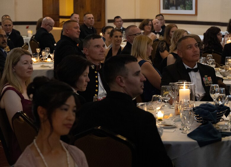 U.S. Marine Corps Col. Peter Rummler, commanding officer, Recruit Training Regiment, center left, and other attendees listen to speakers at the 2023 San Diego Area Navy Chaplain Corps Ball in San Diego, California, Oct. 19, 2023. This was the first chaplains' ball in the area since 2019 due to COVID-19.  (U.S. Marine Corps photo by Staff Sgt. Melissa L. Karnath)