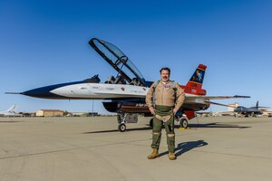 Dr. Christopher Cotting, the outgoing director of research at the U.S. Air Force Test Pilot School, and Bill Gray, TPS Chief Test Pilot, celebrate after Cotting's "fini-flight" with the X-62A Variable In-flight Simulation Test Aircraft on Edwards Air Force Base, California, Nov. 8. (Air Force photo by Lindsey Iniguez)