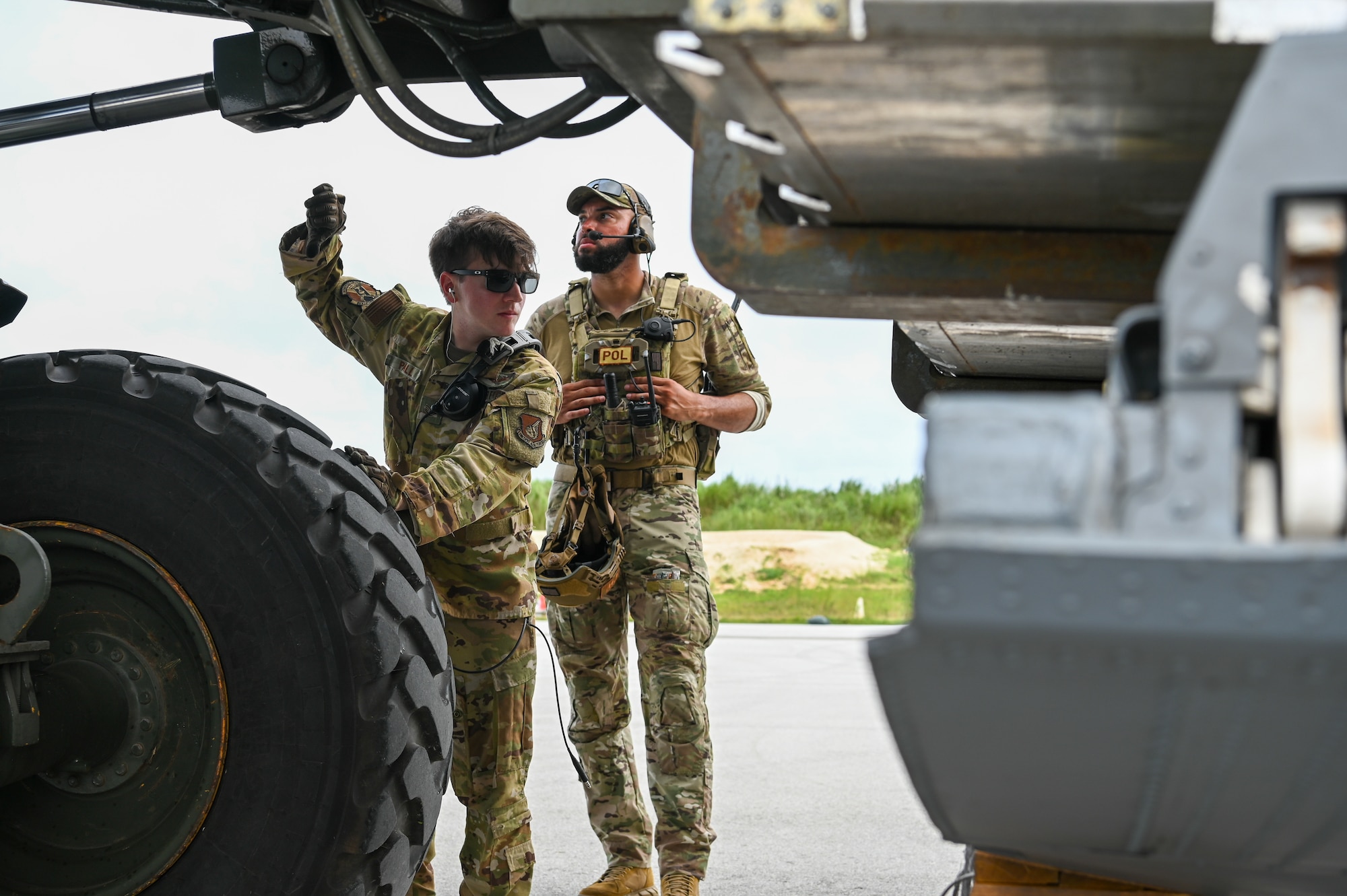 U.S. Air Force Airmen with the 36th Contingency Response Squadron load cargo onto an aircraft on Pacific Regional Training Center-Andersen, Guam, Nov. 17, 2023. Multiple squadrons assigned to the 36th Wing participated in a simulated deployment exercise to self-evaluate and gauge their skills in a deployed scenario to better accomplish the mission.(U.S. Air Force photo by Senior Airman Allison Martin)