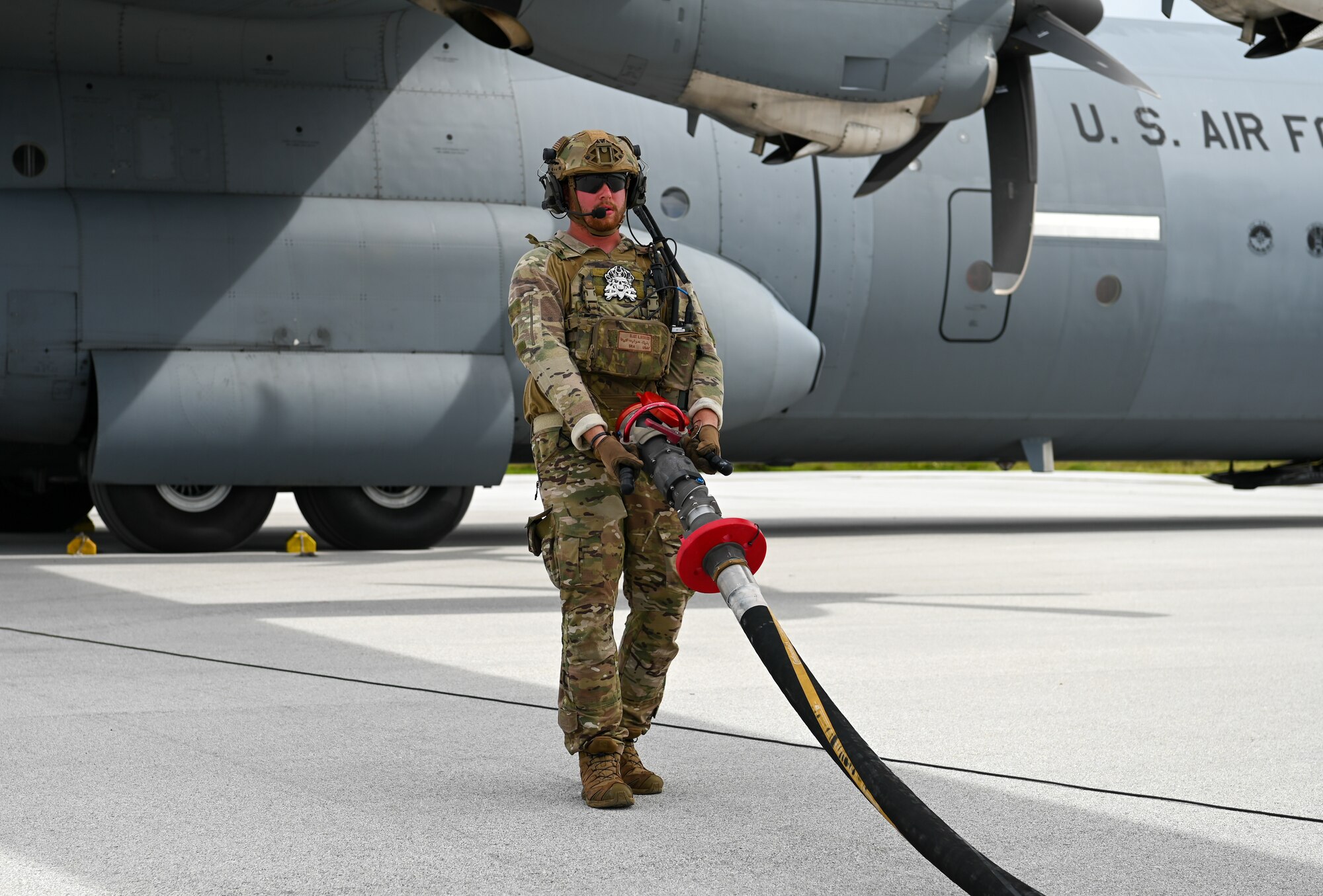 An U.S. Air Force Airman with the 36th Contingency Response Squadron carries a fuel pump on Pacific Regional Training Center-Andersen, Guam, Nov. 17, 2023. Multiple squadrons assigned to the 36th Wing participated in a simulated deployment exercise to self-evaluate and gauge their skills in a deployed scenario to better accomplish the mission.(U.S. Air Force photo by Senior Airman Allison Martin)